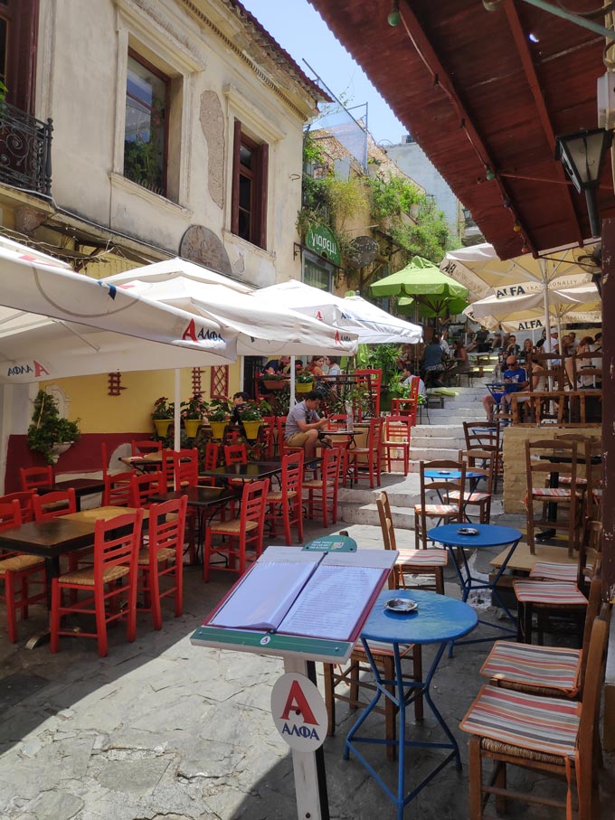 One of the alleys of Plaka with lots of tavernas and restaurants and outdoor seating.