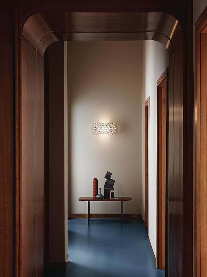 A wall sconce featured at the end of a corridor. Image via Nest.co.uk.