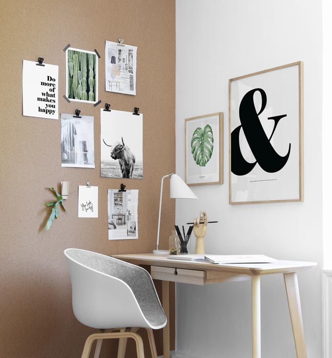 A home office with a gallery wall that includes some typography prints for impact. Image by Desenio.
