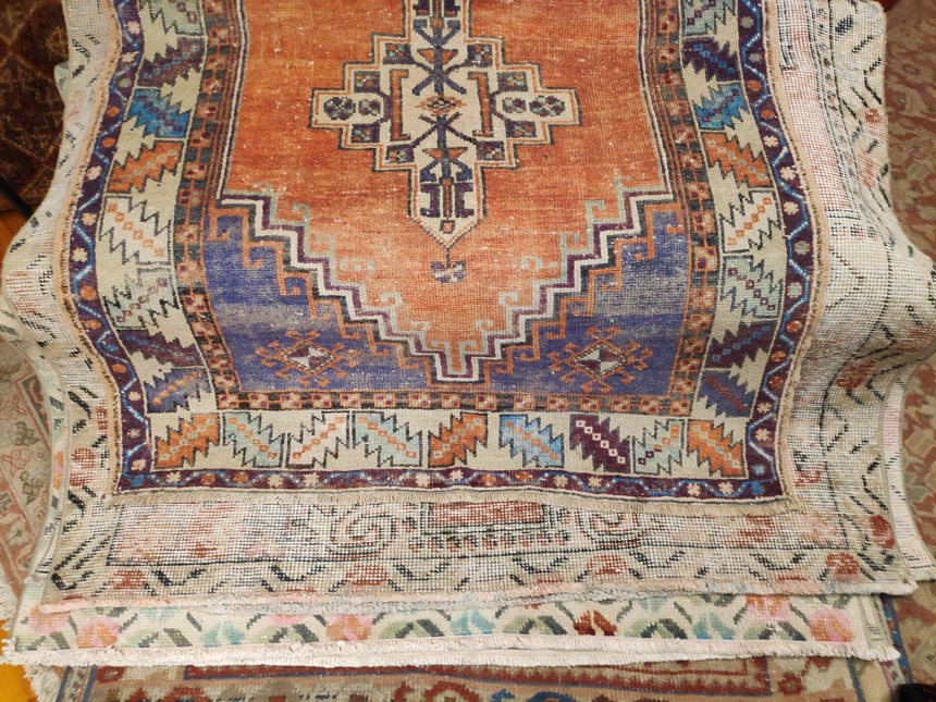 A Persian vintage rug with geometric patterns