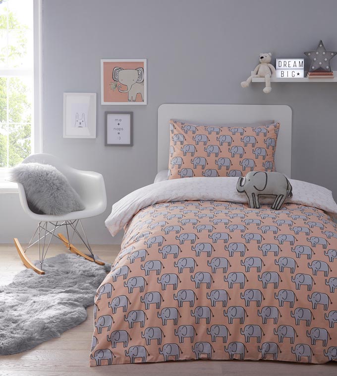 A stylish minimal kids bedroom with a playful print pattern bedding. Image by Debenhams.