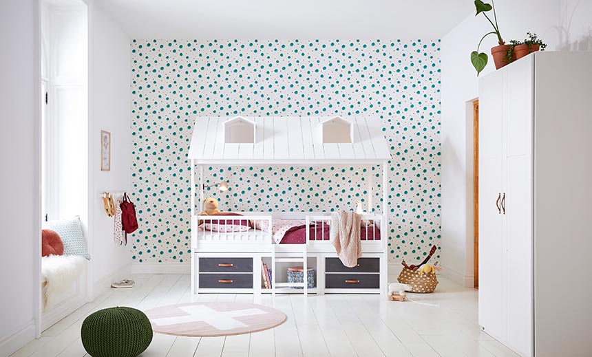 A beautiful kid's room with a theme bed in front of accent wall. Image by Cuckooland.