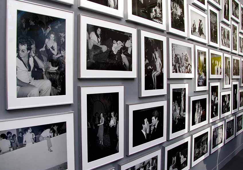 A black and white photography art gallery wall taken from an angle