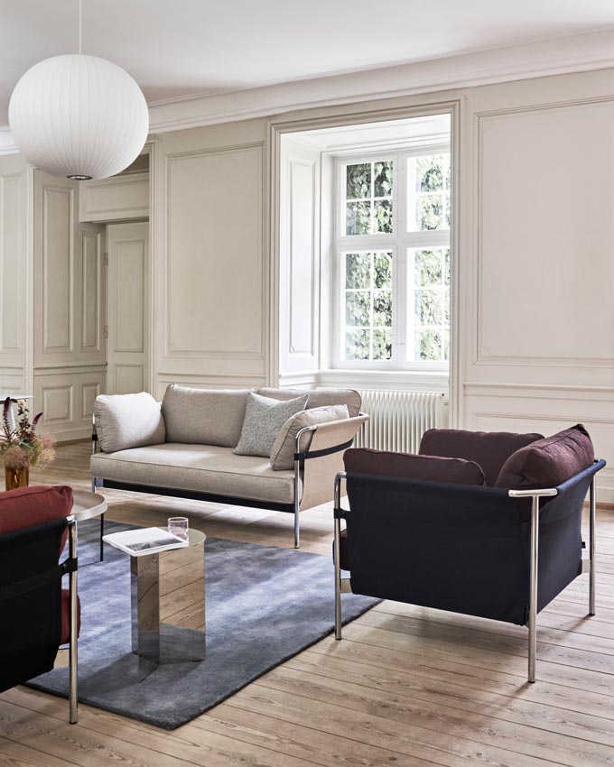 A stylish contemporary living room with two armchairs and an off white sofa. Image via Nest.co.uk.