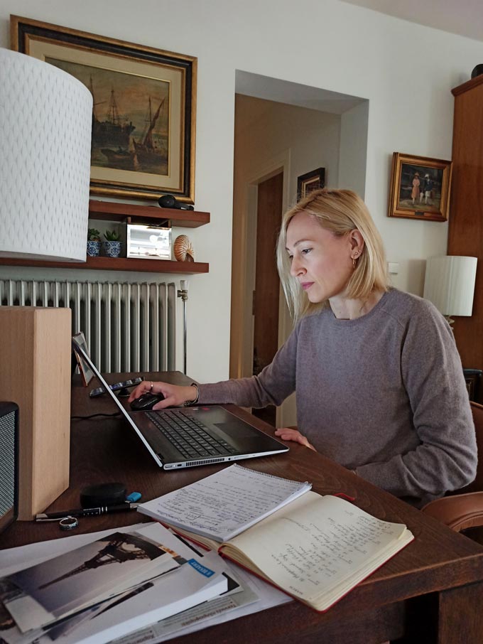 Velvet typing away on a laptop while blogging.