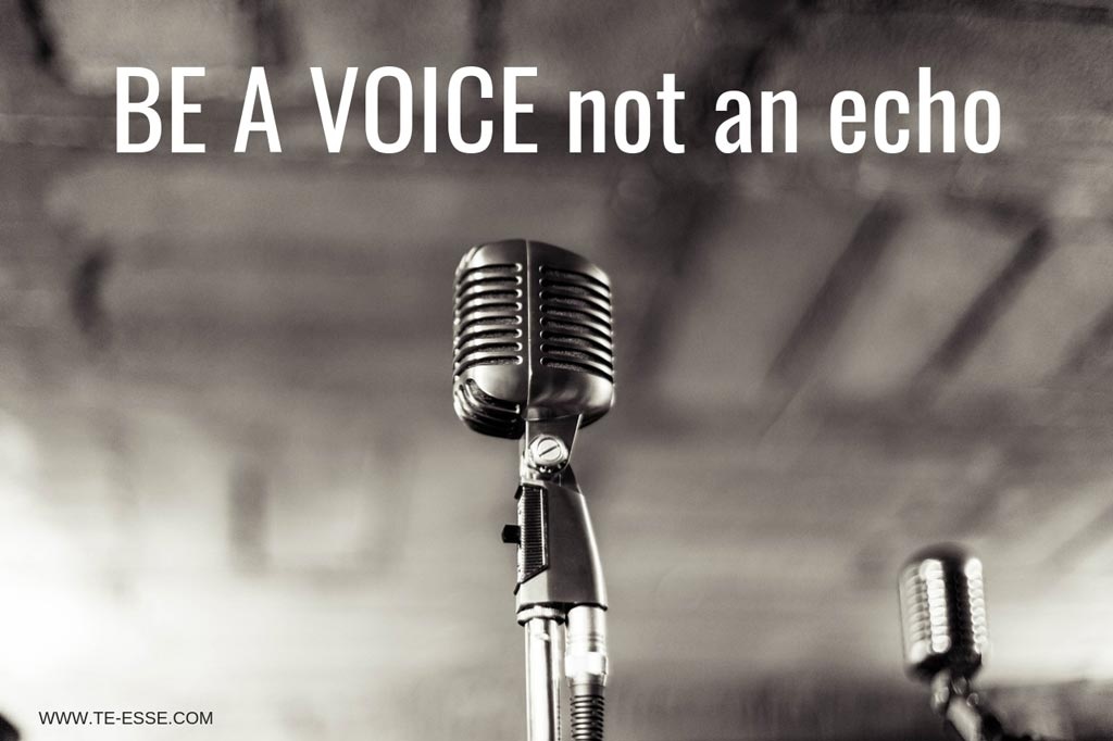 A black and white image of an old microphone. Be a voice not an echo reads the writing over it.