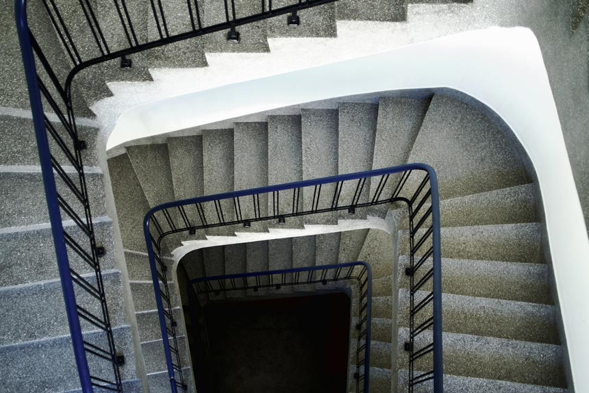 A stairwell with terrazzo steps.