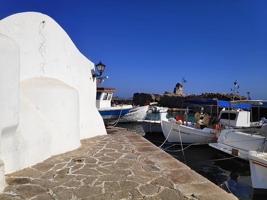 Partial view of the port of Naoussa in Paros with the white chapel on the left. Image by Velvet.