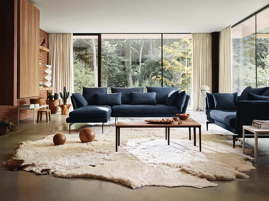 A minimal but warm and cozy living room with the Vitra Suite blue sofas creating a focal point. Image by Nest. One of the six interior decorating fail proof tips calls for editing and layering.