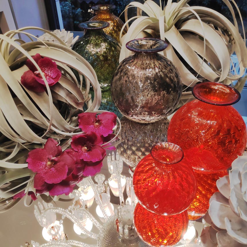 Murano vases from Venini on a mirror surface. Image by Velvet.