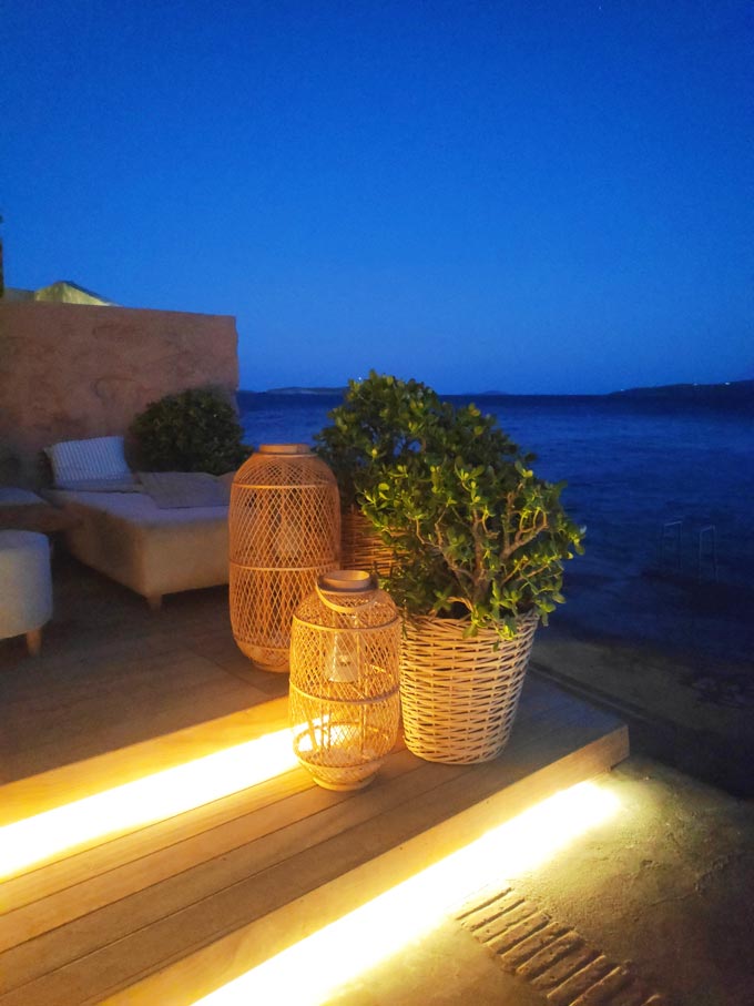 An outdoor setting with sea view after sunset hours in Syros.