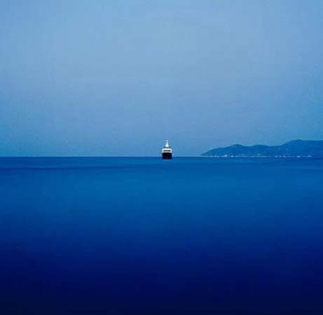 A ship sailing in a deep blue sea. Image by Stratos Kalafatis