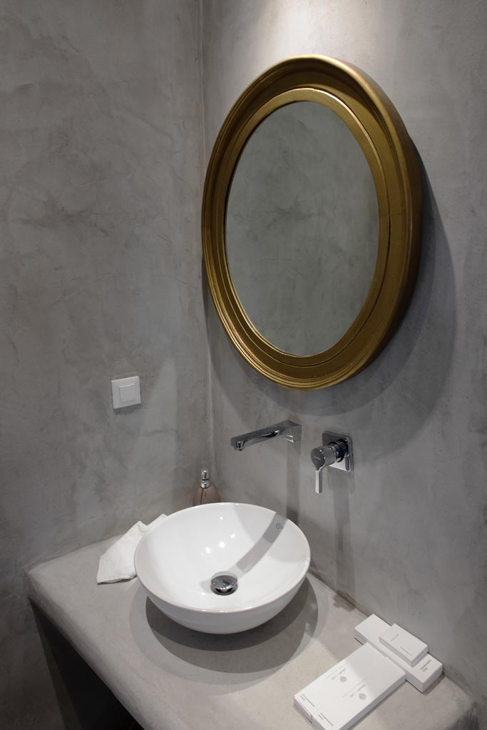 The vanity of a microcement bathroom. Image by Antonis Drakakis.