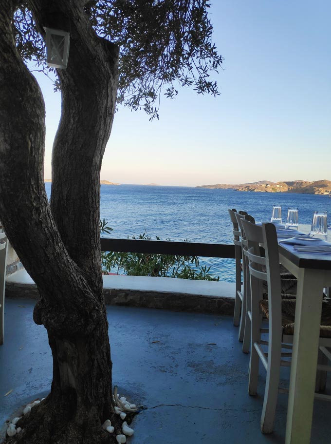 An outdoor setup of a local Greek taverna known as At Vaporia in Ermoupolis Syros. Image by Velvet.