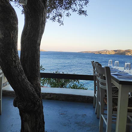 An outdoor setup of a local Greek taverna known as At Vaporia in Ermoupolis Syros. Image by Velvet.