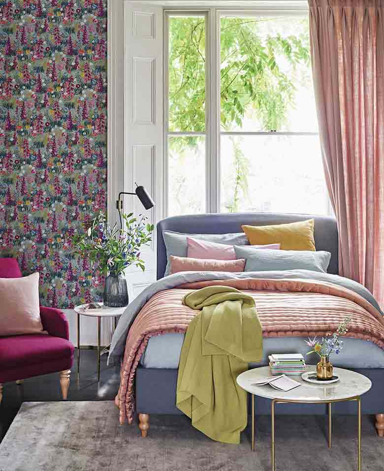 A maximalist bedroom with tones of pink and blue. Image be John Lewis