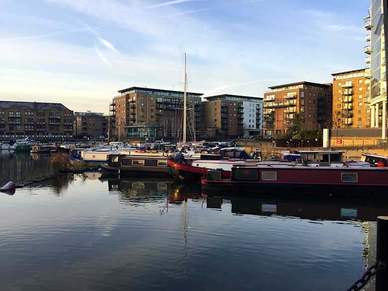 View of part of Docklands with some housing buildings in the background and a mooring dock in the foreground