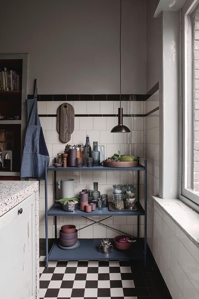 A blue iron shelving unit making a great kitchen vignette. Image by Nest.