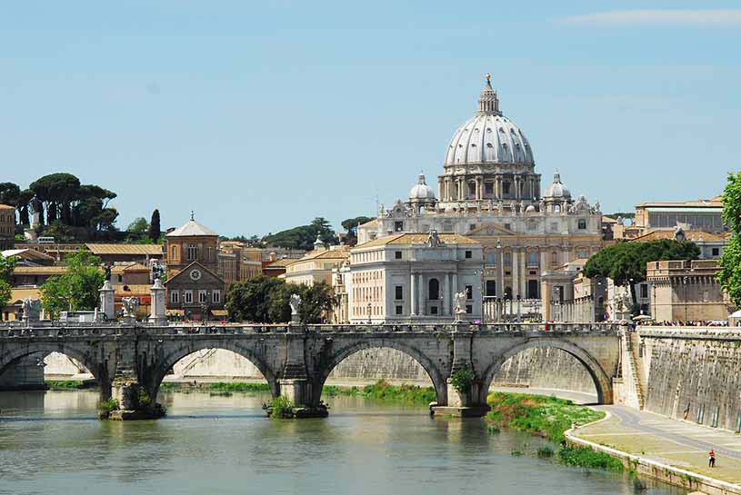 View of the Vatican City from Tiber with the old bridge showing
