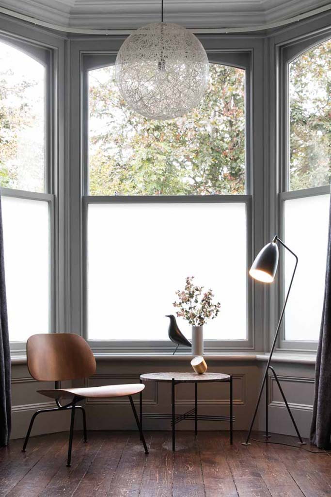 The Vitra LCM Eames Plywood Lounge Chair looking good in its simplicity by a bay window. A side table and a floor lamp is all it needs to showcase its natural beauty. Image by Nest.co.uk