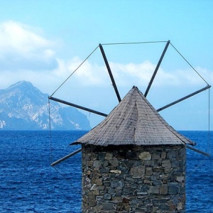 An old mill in the foreground and the Aegean Sea in the background. View from Amorgos.