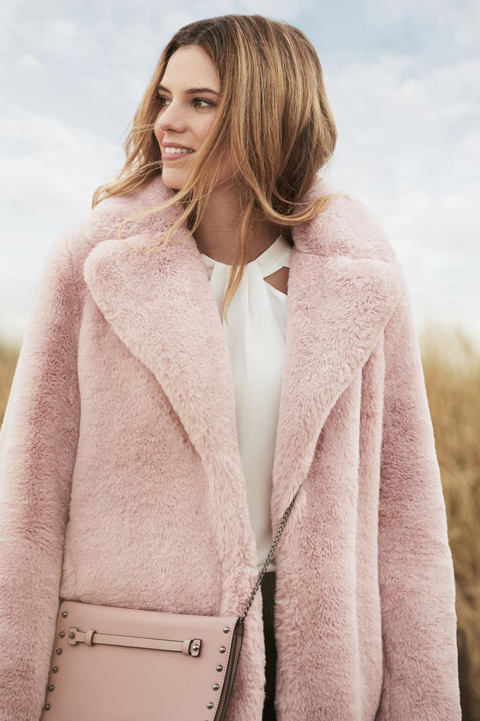 I love this pink fur coat with a white top under it. So feminine. Image by Dorothy Perkins.