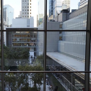 Partial view of the Museum of Modern Art in NYC looking from a window inside it.