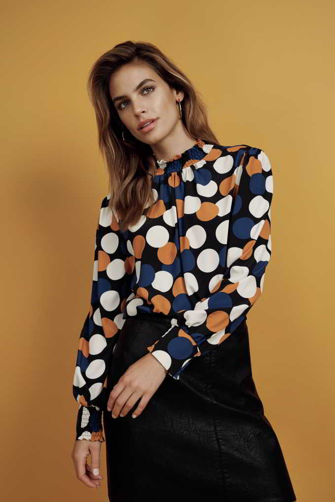 Now that is a cool print shirt paired with a black skirt. The colors of spiced honey, blue and white on that shirt really make a huge difference. Image by Dorothy Perkins.