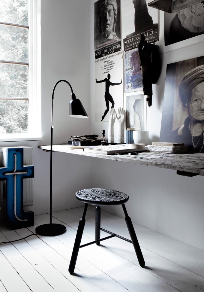 Now that looks like a home office studio that I would like to have with all those images on the wall, a really big tabletop to fit it all and plenty of light coming from the window. The black floor lamp and black stool make it all just perfect. Image by Nest.co.uk.