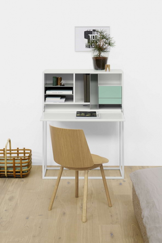A small but surely tidy white desk with compartment slots for an organized look. Image by Nest.co.uk.