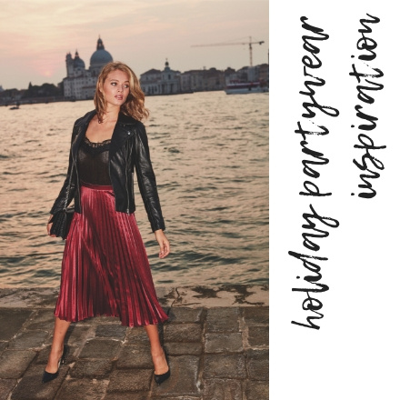 Now this combination is calling my name!! A black leather jacket over a black silk spaghetti strap top paired with a burgundy long pleat skirt and black pumps! Wow! Venice cityscape appears in the background. Image by Sosandar.