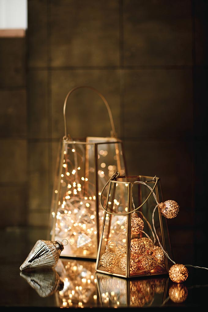 Two lanterns with fairy lights in them. Image by Marks & Spencer.