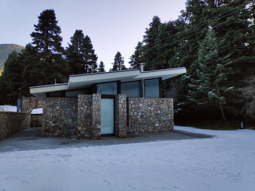 External view of the guest house made primarily of stone.