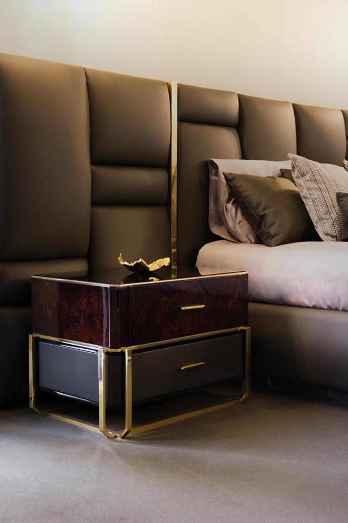 What a beautiful nightstand paired with an amazing textured headboard that spell out luxury. Image by LUXXU.
