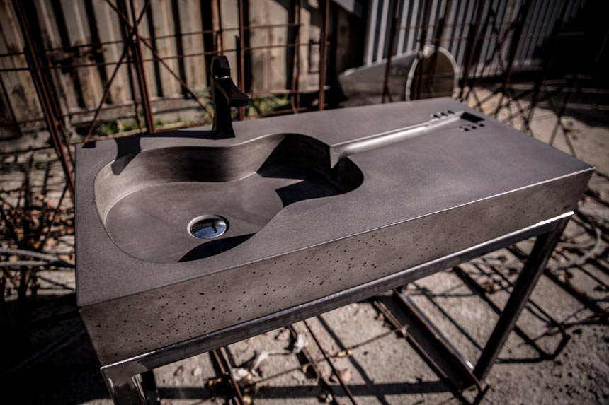 Why not break from the norm? A guitar shaped concrete sink as desktop mount by Smithers of Stamford. 