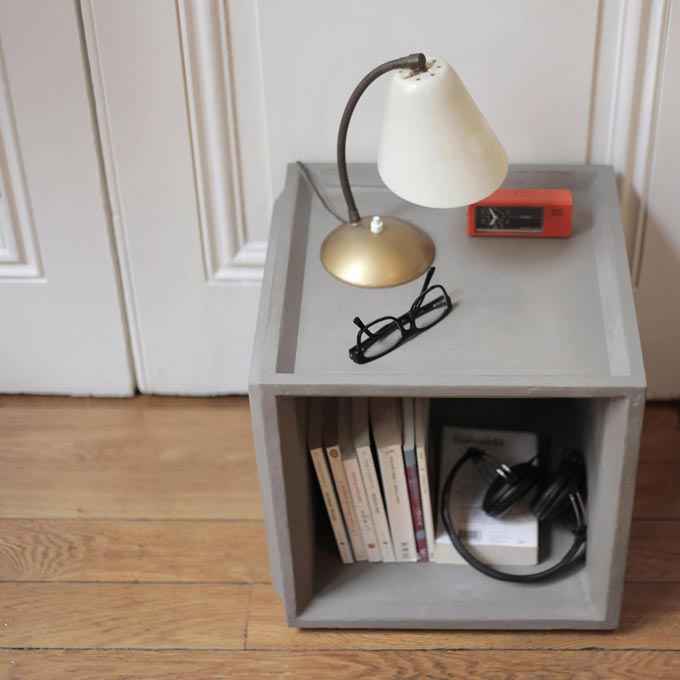 A storage unit made of concrete that can easily serve as a nightstand too. Image by Lime Lace.