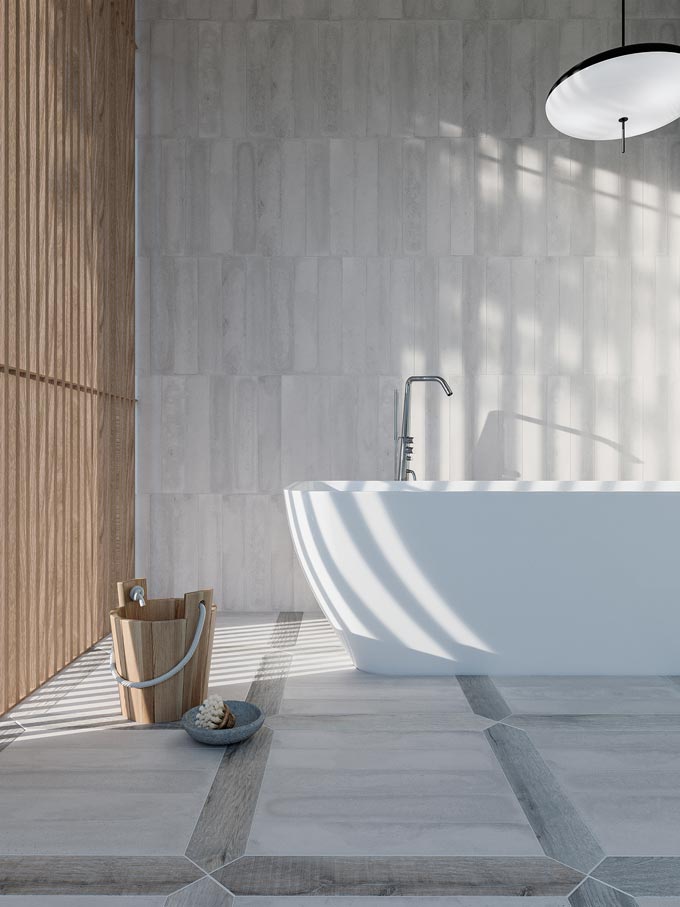 A large white contemporary tub on cement like tiles by WOW Design. The wooden slats on the left filter the sunlight while creating a really Zen feeling. Image by WOW Design.