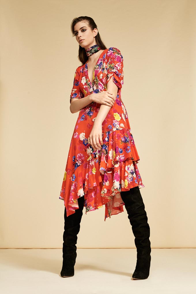 I love this red floral print dress with easy going flares styled with knee high black boots. Image by Debenhams.