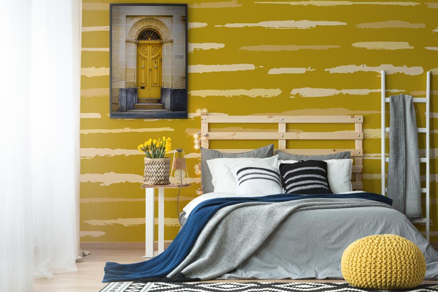 Teen bedroom decorating ideas: A mustard wall mural looking awesome in a contemporary bedroom. Image by Pixers.