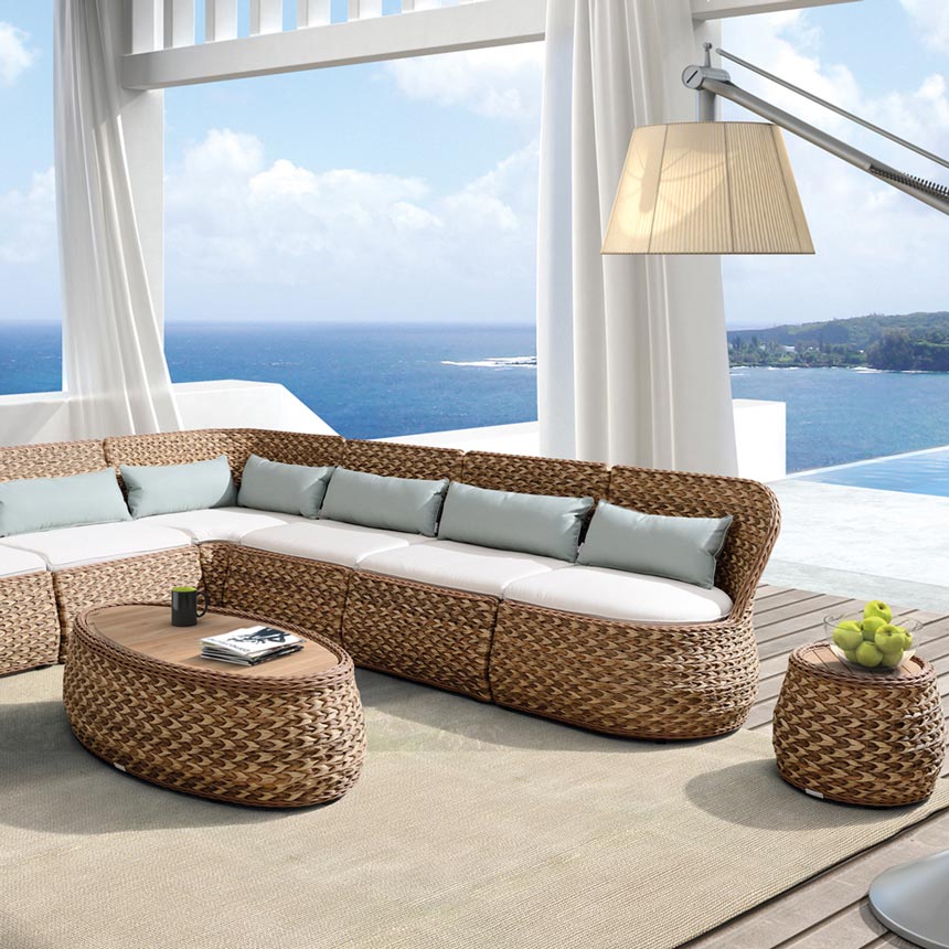 Imagine a covered outdoor space with a sea view and a rattan corner sofa on the deck with a coffee and side tables just like this one. Wow. Image by Image by Sweetpea & Willow.