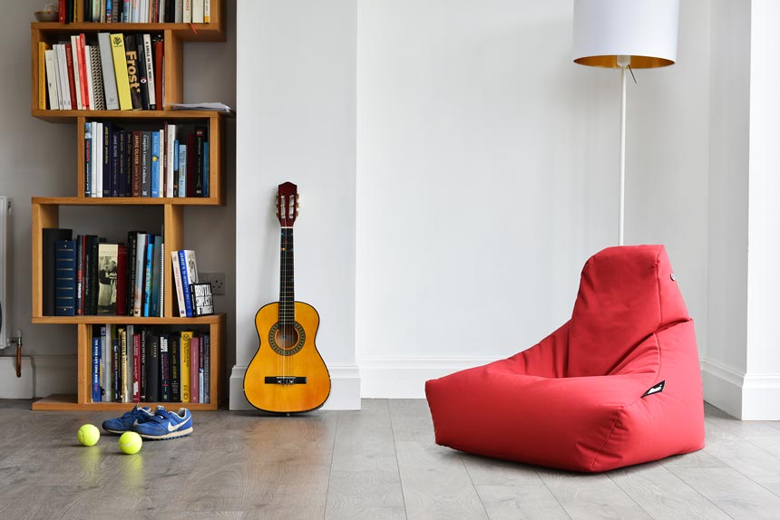 A red bean bag, a guitar and a bookcase filled with books are all things you should expect to see in a teen's bedroom. Image by Cuckooland.