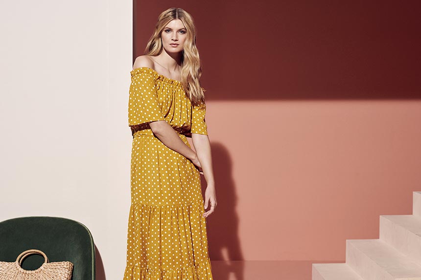 A mustard colored Bardot dress with white polka dots. Can you resist this? Image by Dorothy Perkins.