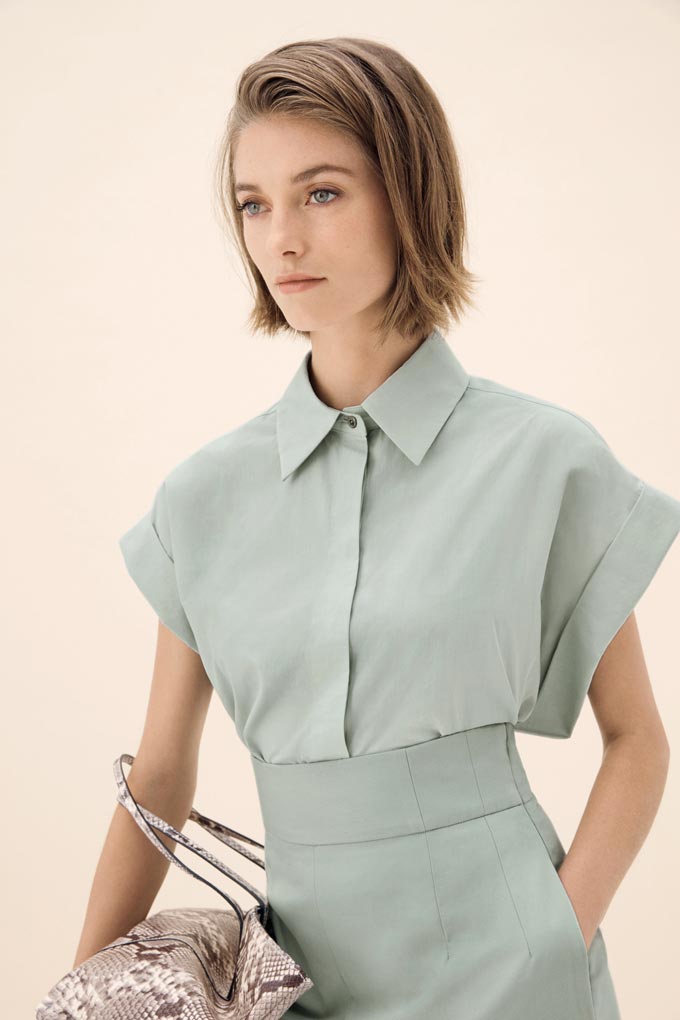 An all mint outfit like this shirt and high rise pants is very chic. Image by Hobbs.