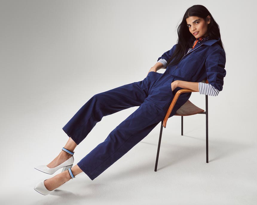 A denim jumpsuit with a striped top underneath and white pumps is looking awfully good. Image by Marks and Spencer.