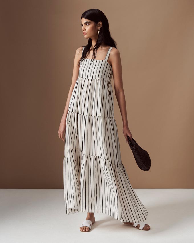 A white stripy maxi sleeveless dress. Image by Marks & Spencer.