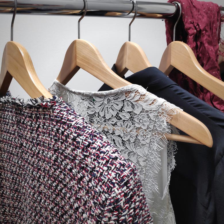 Close view of clothes hanging. Image by Velvet.