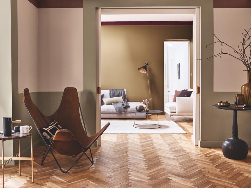 A beautifully painted interior like this in warm tones can go a really long way. The herringbone pattern hardwood flooring compliments it all. Image by Dulux.