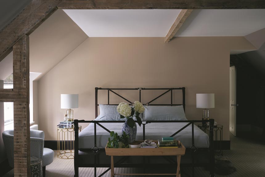 On finding the right paint color. A beautiful bedroom with a warm and neutral color palette looking simple but very elegant. Image by Farrow and Ball.