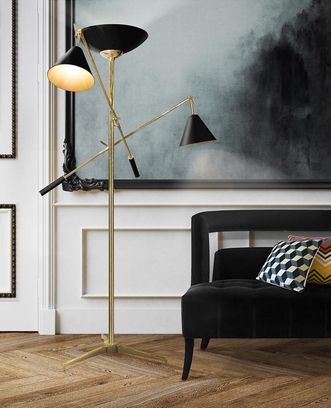 The Torchiere, a floor lamp with so many add on arms with a golden and black finish makes perfect for uplighting, downlighting and reading lighting. In this image it stands out against an art image. Image by DelightFULL.