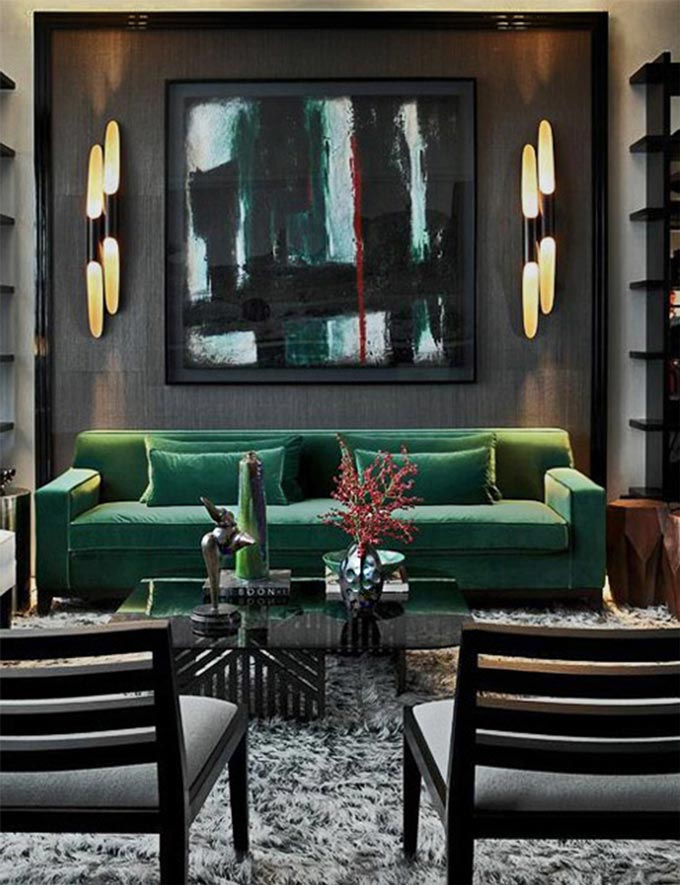A stunning living room with a forest green velvet sofa, an accent artwork, gorgeous lighting are a few of the elements that make it all so fascinating. Image by DelightFULL.